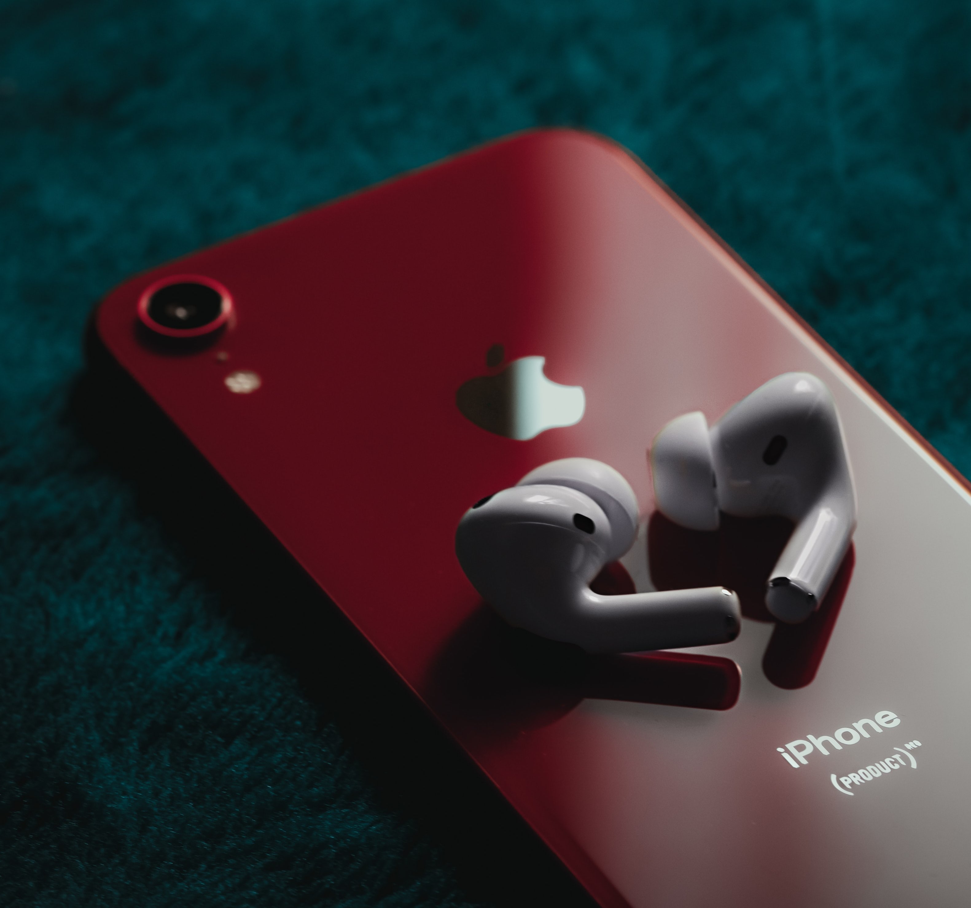 IPhone Product Red back AirPods white