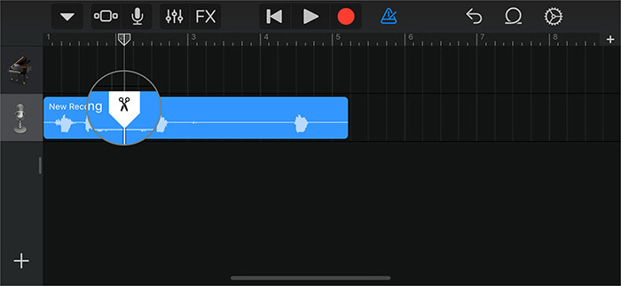 Trascina le forbici verso il basso per tagliare parte della nota vocale nell'app GarageBand