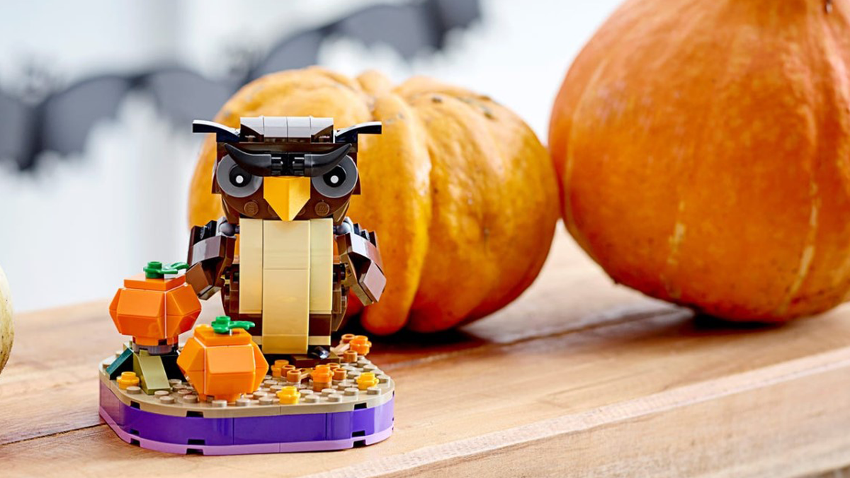 LEGO Halloween Owl set next to pumpkins and other season decor