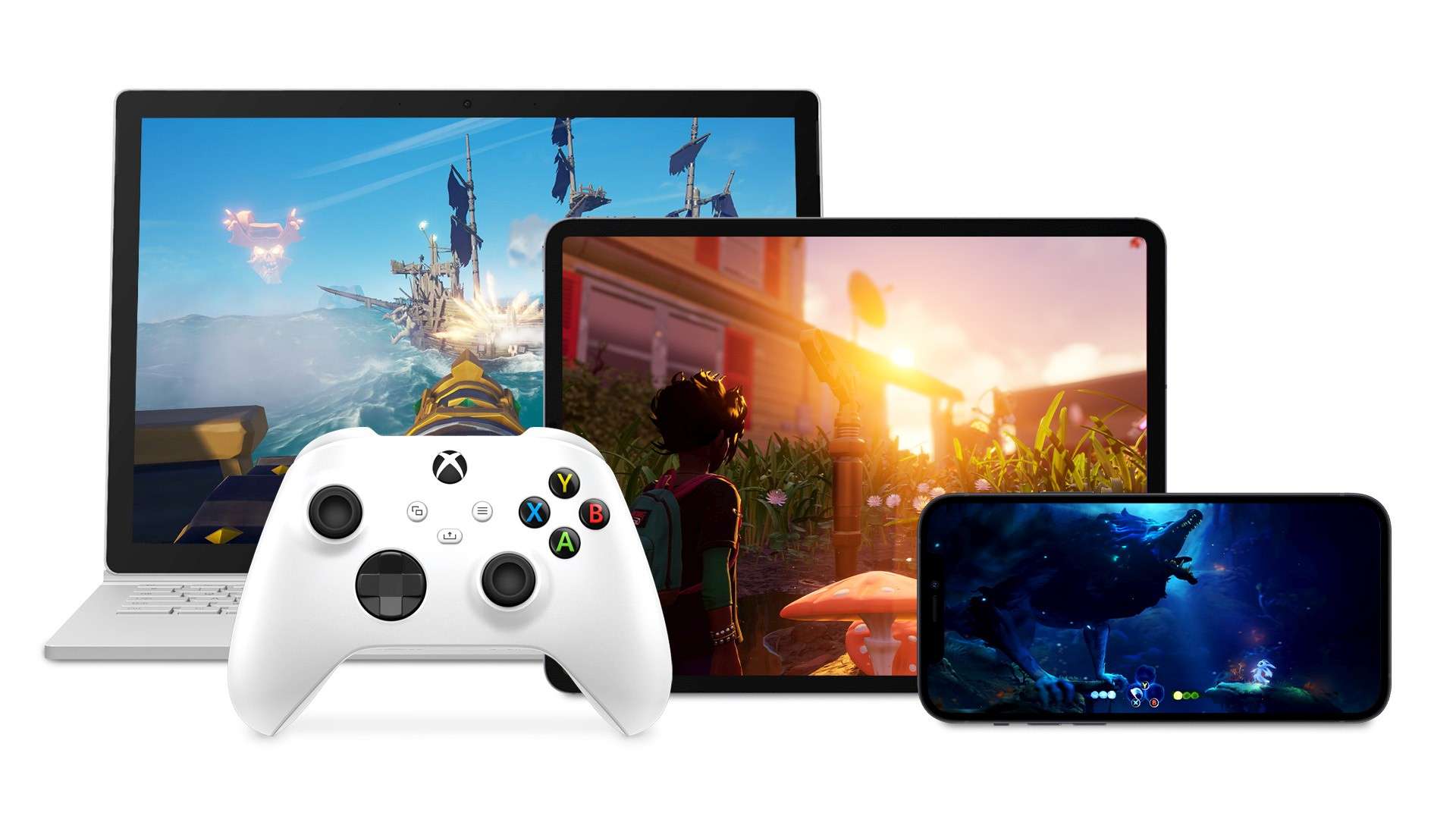 Bộ điều khiển Xbox phía trước máy tính xách tay, iPad và điện thoại Android đều chơi trò chơi Xbox