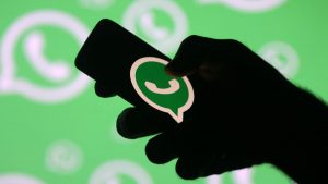 whatsapp_logo_phone_dark_in_hand_banner